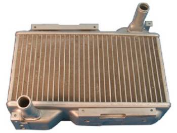 Why is it important to use an aluminum heater core instead of brass and copper?